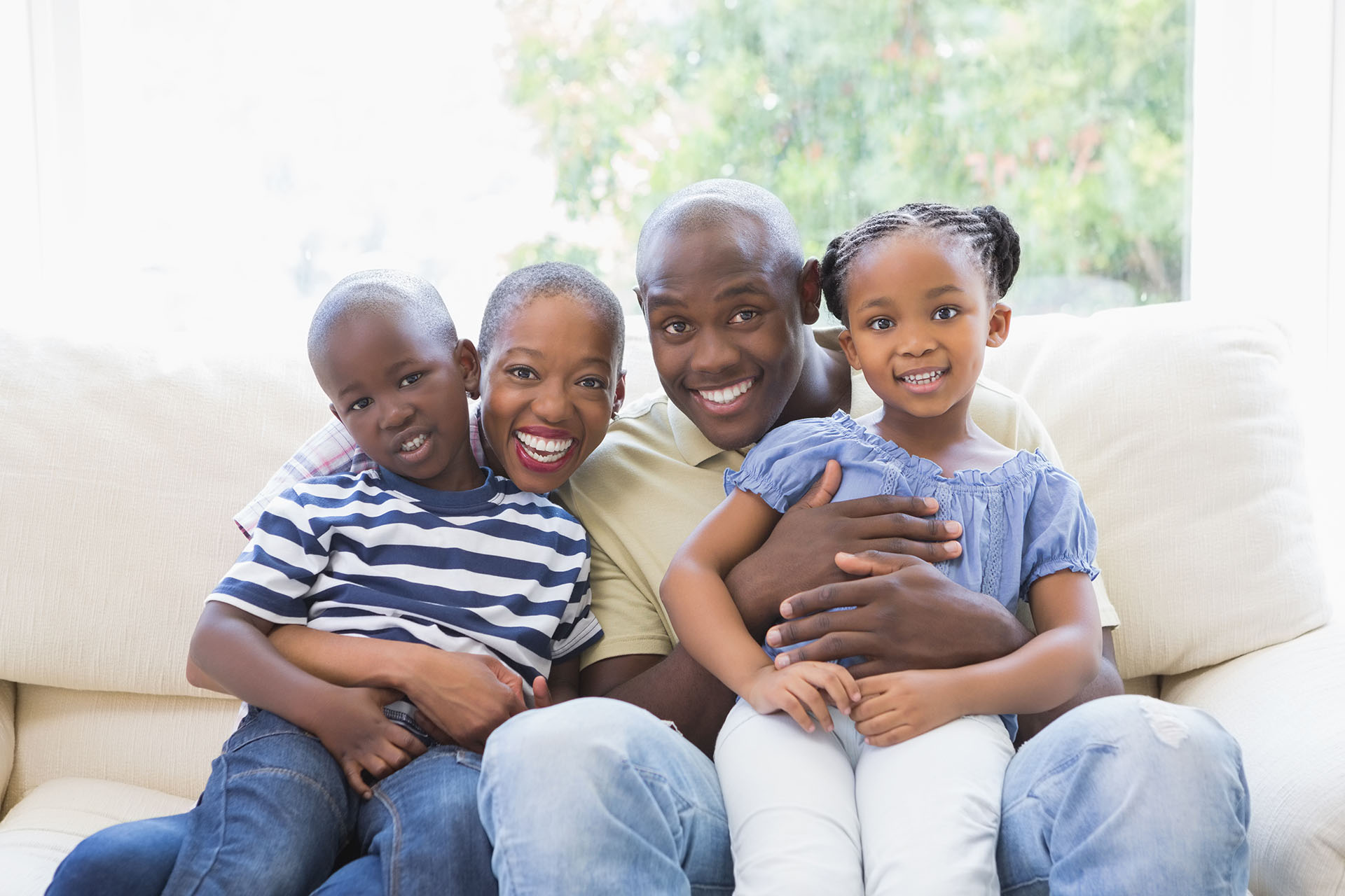 Happy family on the couch in the living room; Shutterstock ID 307288631; PO: 666