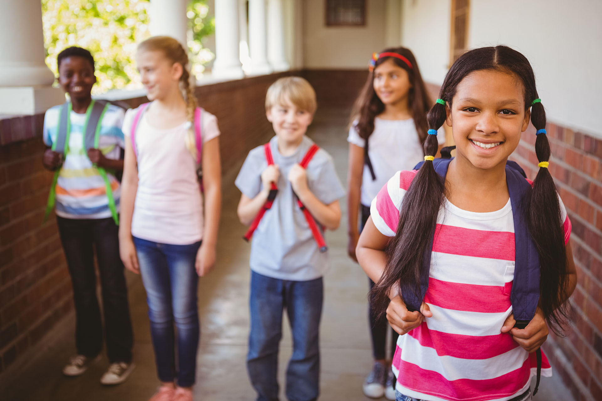 Portrait of smiling little school kids in school corridor; Shutterstock ID 256067281; PO: 666
